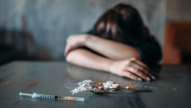 Female junkie hand hand reaching for the dose�