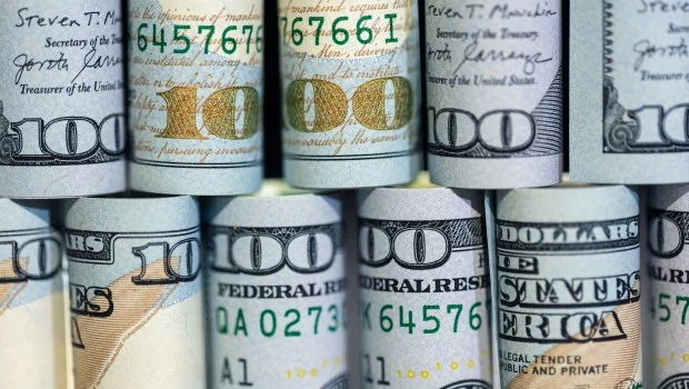 Close-up of twisted 100 dollar bills. Finance concept background.�