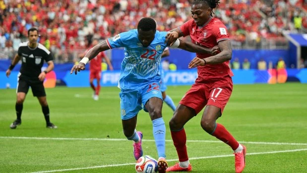 Rafael Leao (R) of Portugal and Chancel Mbemba of DR Congo in action during the FIFA World Cup 2026 group stage match Portugal against Democratic Republic of Congo.